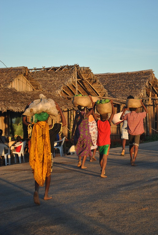 Women in Madagascar carrying food home
